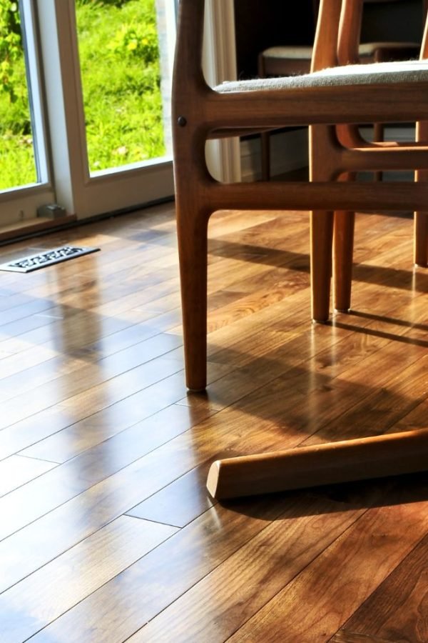 A dining room featuring a table and chairs, showcasing elegant flooring, highlighting a flooring service in Washington, DC.
